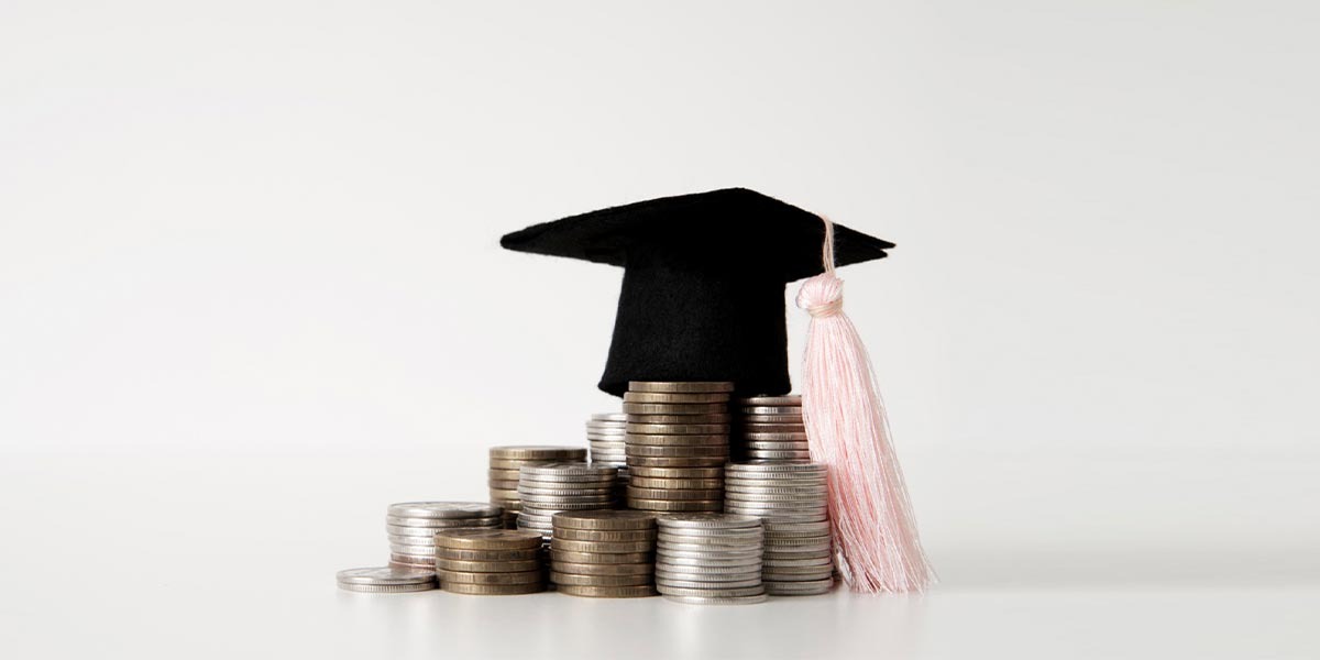 Graduation Cap above the money